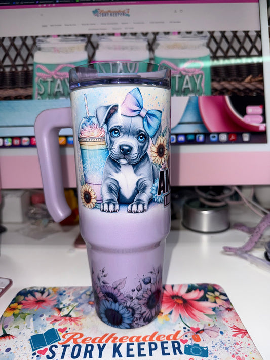 30 oz Anxiety Loading Grippy Tumbler Limited Edition - handle side view showing single pitbull puppy with blue bow holding a frappe cup surrounded by sunflowers