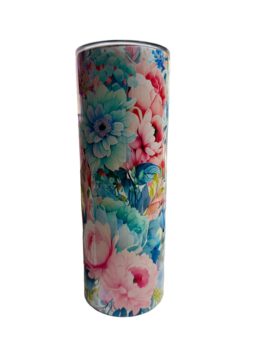 Floral-patterned tumbler on a desk with office items in the background