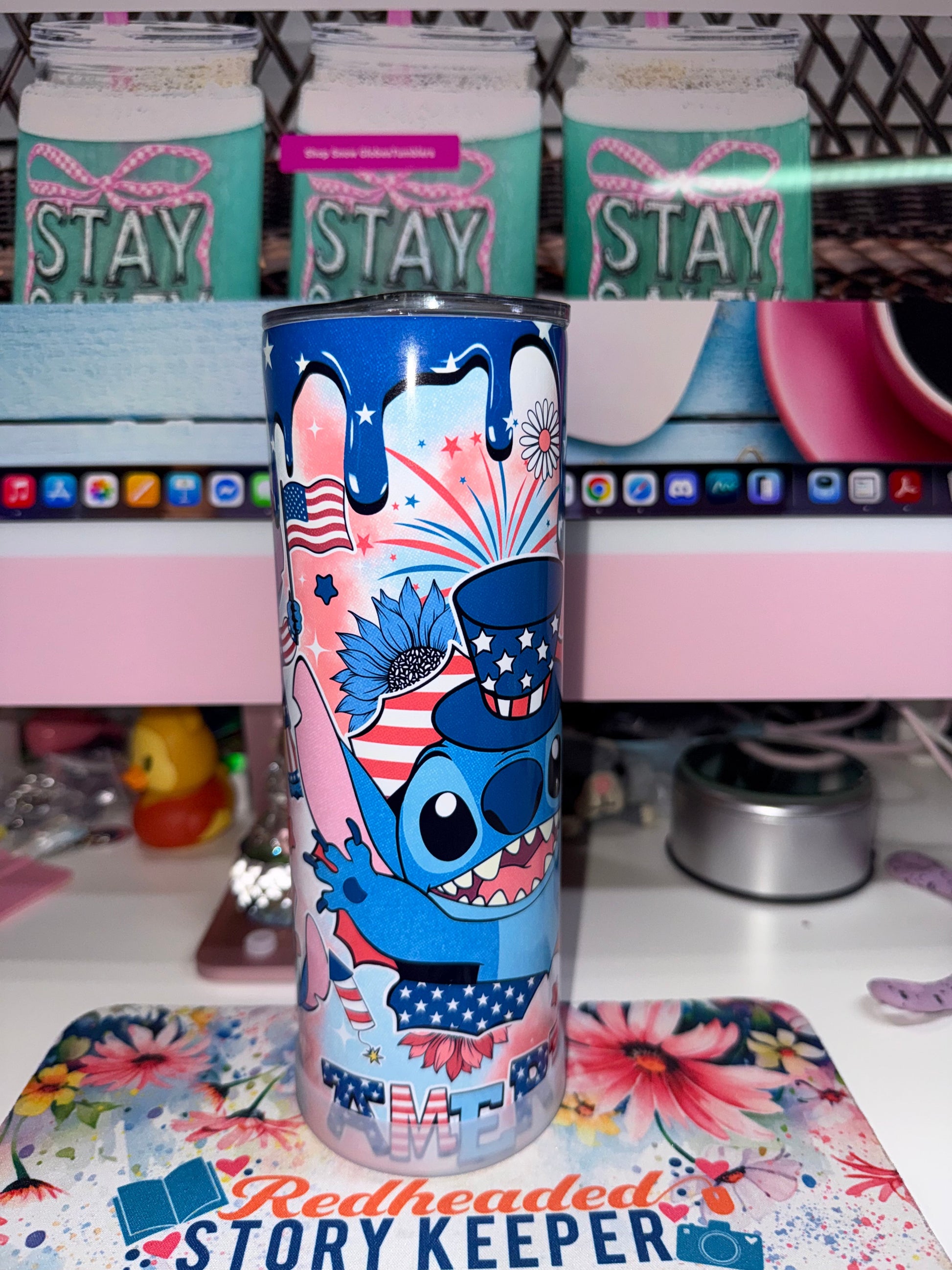 20 oz America Stitch Tumbler - side view showing Stitch in Uncle Sam hat with sunglasses and blue sunflower close-up patriotic pose