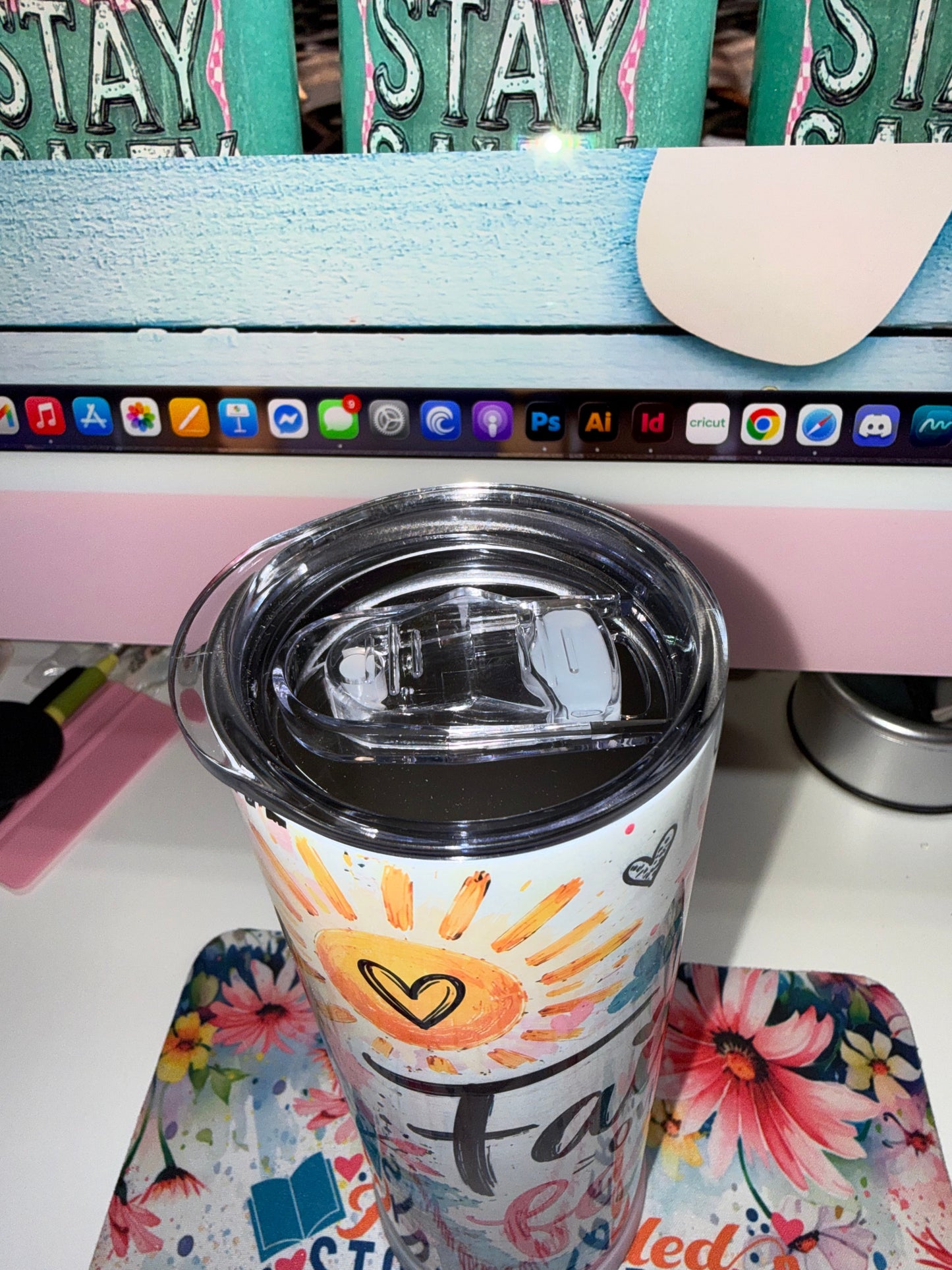20 oz Faith Over Fear Tumbler - top-down view showing clear flip-up locking lid with straw opening and heart sun design below