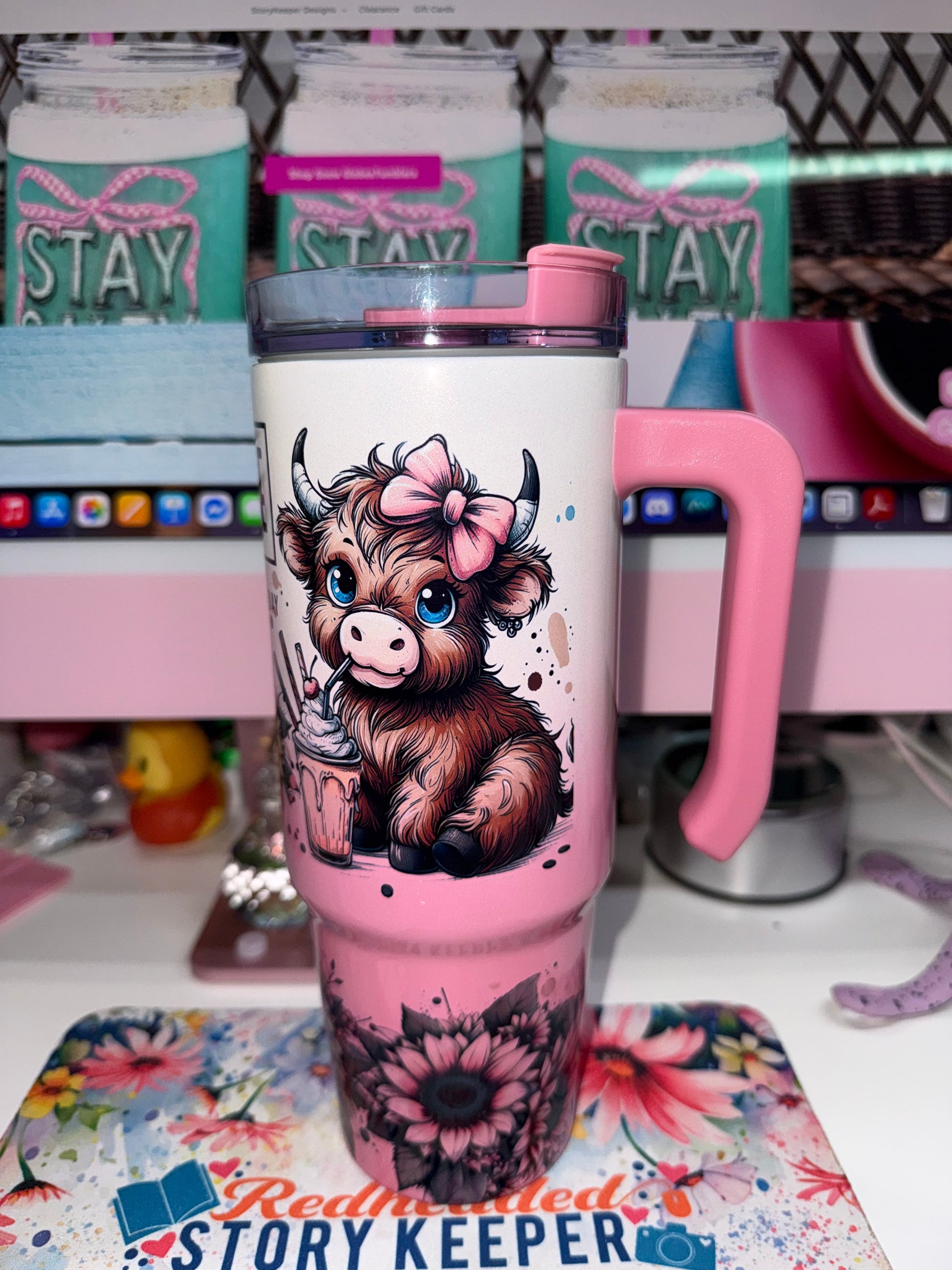 30 oz Coffee Mode Grippy Tumbler Limited Edition - front angle showing full highland cow character with pink bow and frappé cup on pink gradient background