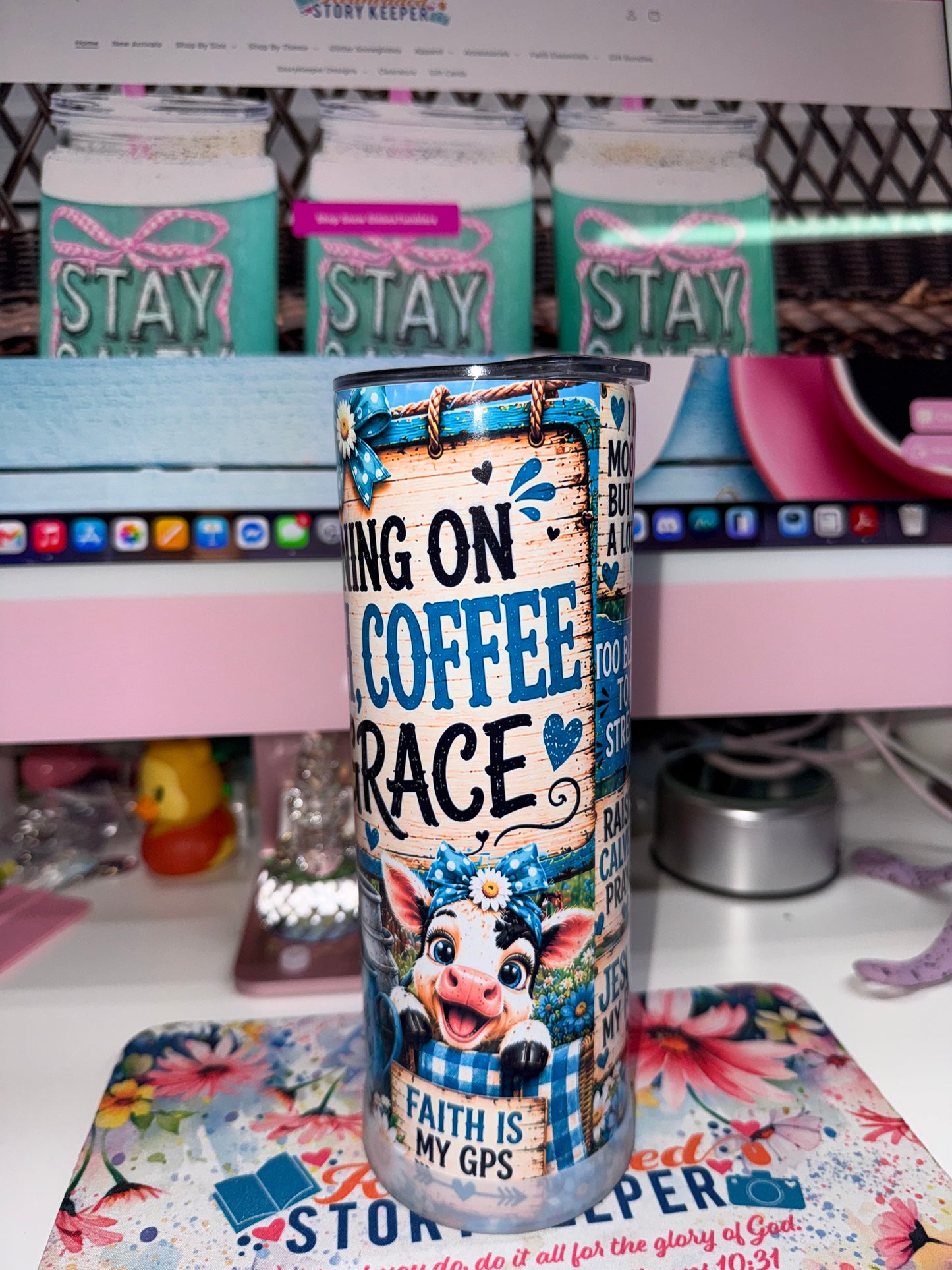 20 oz Running on Faith Coffee and Grace Tumbler - side 1 showing Running on Faith Coffee and Grace text on rustic wood plank with blue bow and daisy