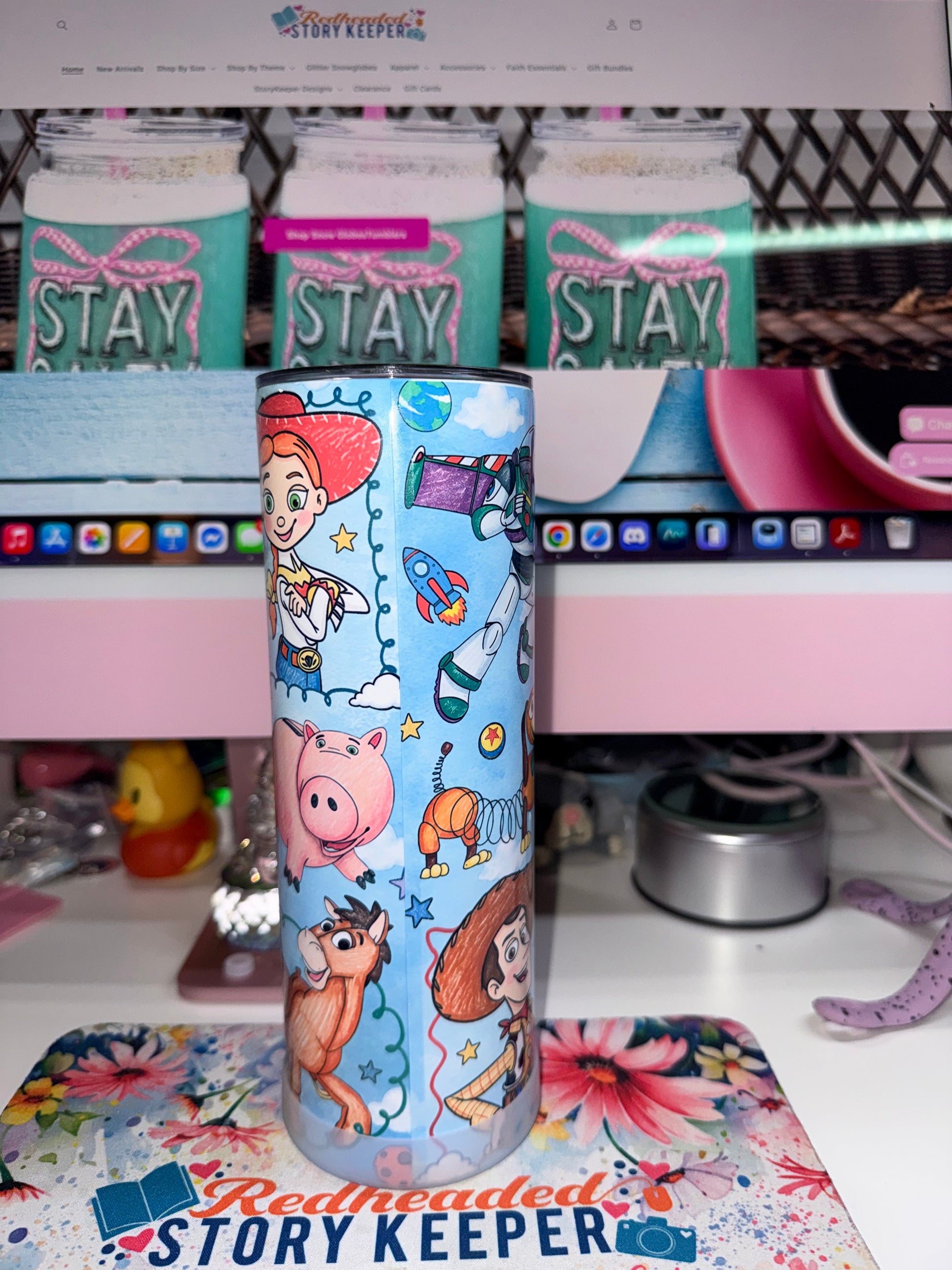 20 oz Toy Story 5 Tumbler - side 2 showing Jessie, Hamm, Bullseye, Woody and Slinky Dog with rockets and planets