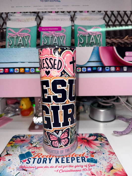 20 oz Blessed Jesus Girl Tumbler - front view showing Blessed Jesus Girl varsity lettering with pink heart, cross and butterfly on black background