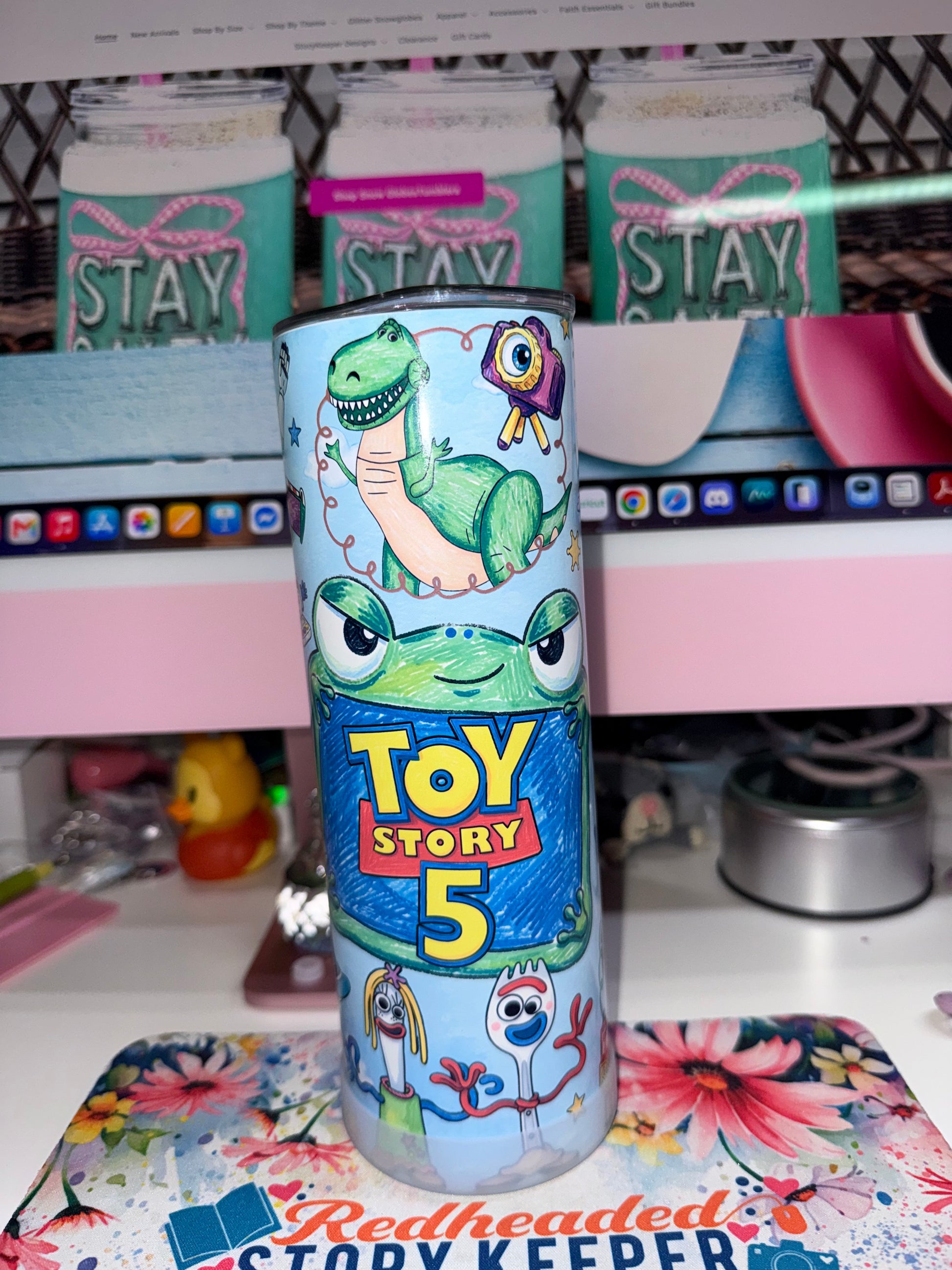 20 oz Toy Story 5 Tumbler - side 4 showing Toy Story 5 logo with Rex, new frog character and Forky