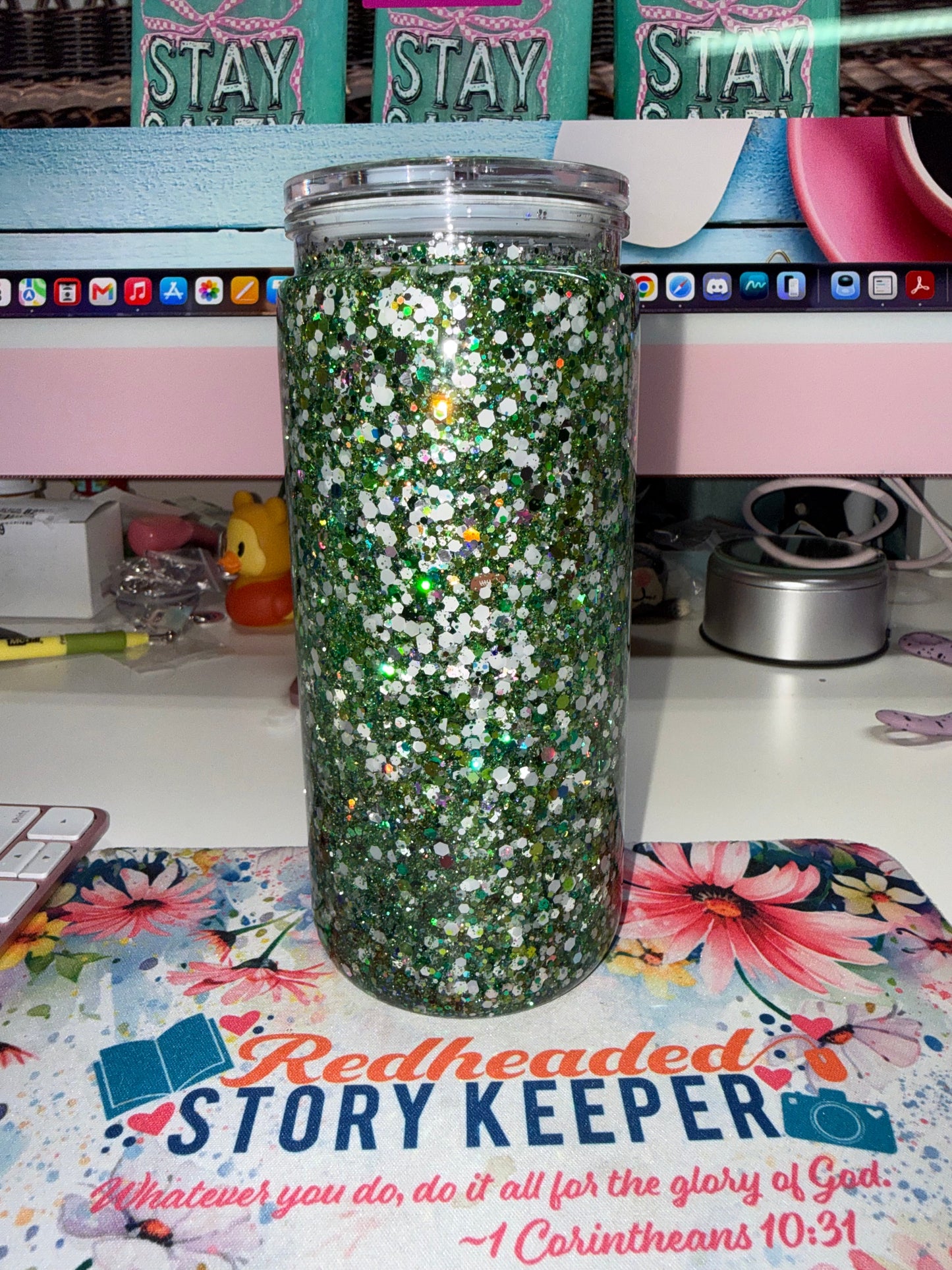 20 oz Eagles Glitter Tumbler - back view showing chunky green and holographic glitter catching light on clear double-wall acrylic tumbler