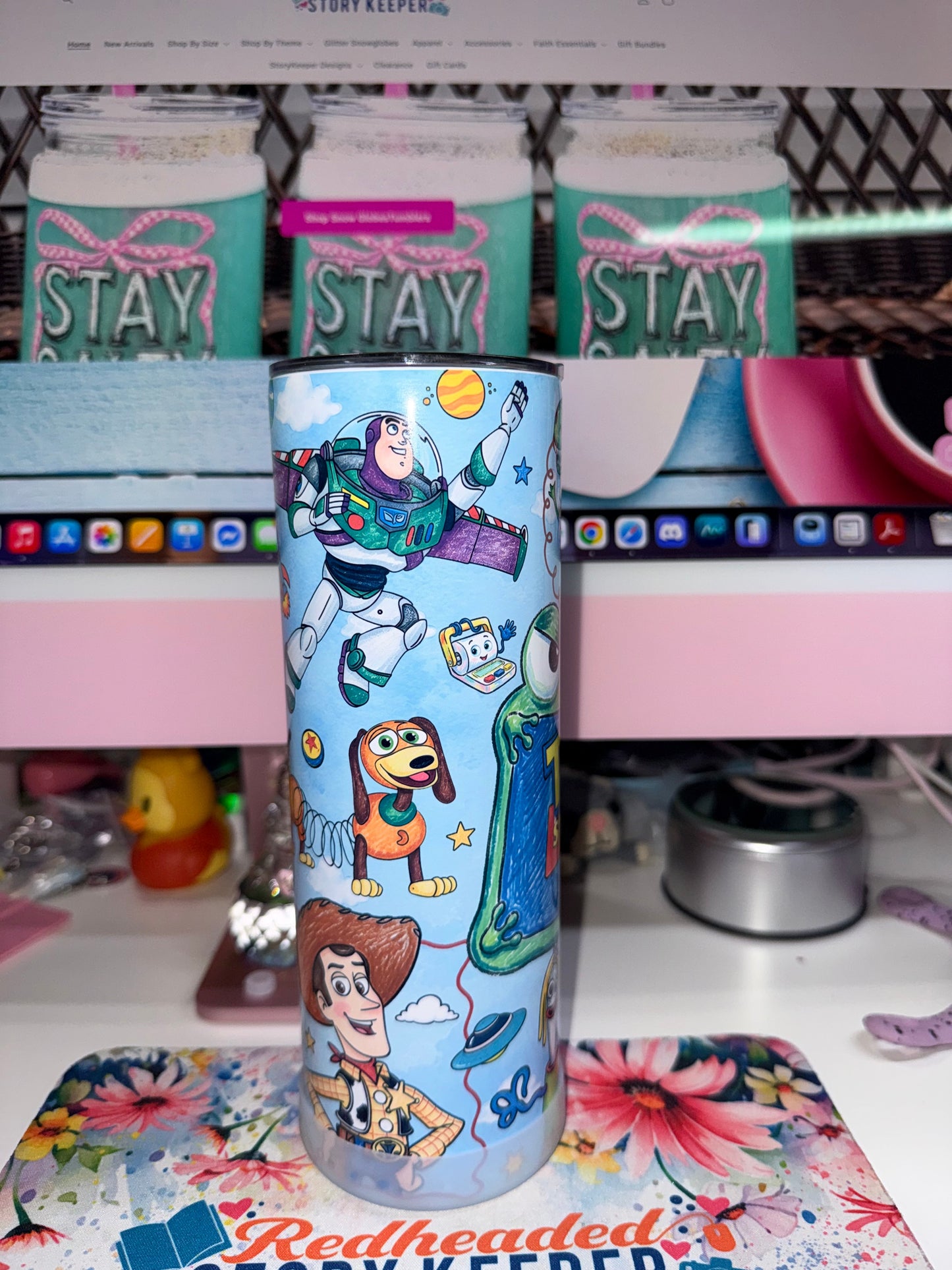 20 oz Toy Story 5 Tumbler - side 3 showing Buzz Lightyear soaring with Slinky Dog and Woody below