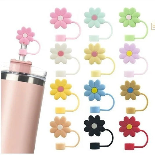 Flower-shaped straw toppers with a pink bottle on a white background