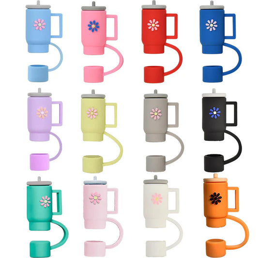 Colorful tumbler straw toppers on white background