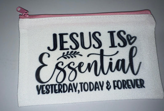 White pouch with 'Jesus is Essential Yesterday, Today & Forever' text on a gray background