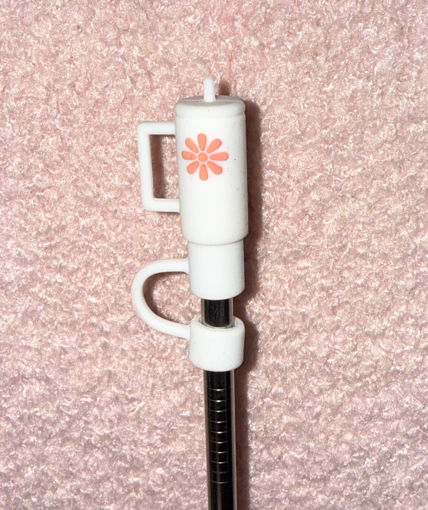 white straw topper shaped like  tumbler on metal straw