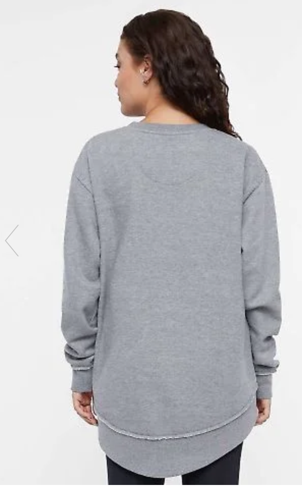 Person wearing a gray sweatshirt on a white background