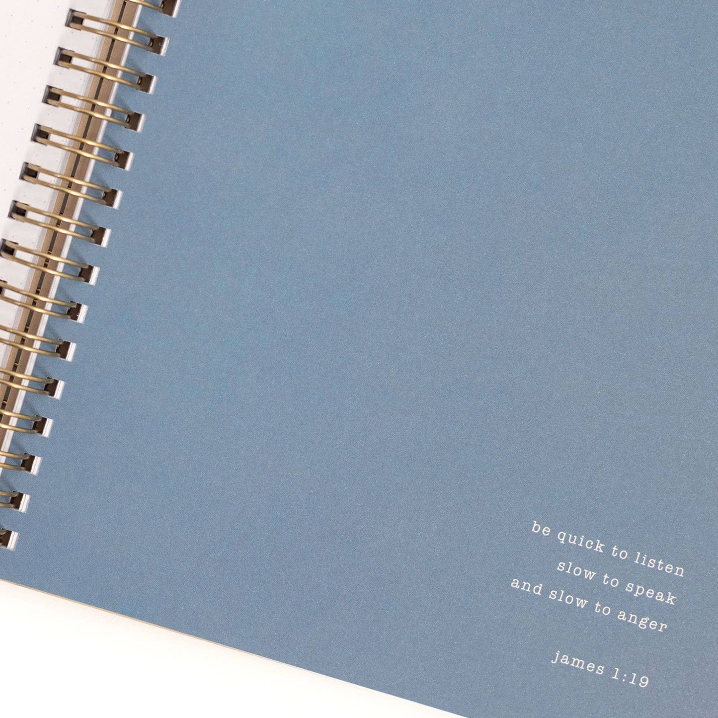Blue notebook with a quote on a white background